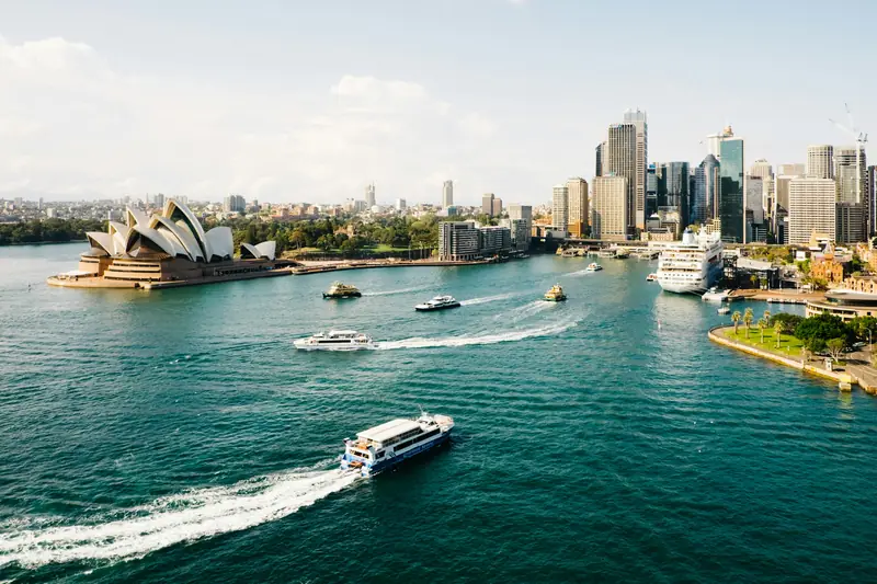Ferries crossing Sydney Harbour with the Opera House and city skyline